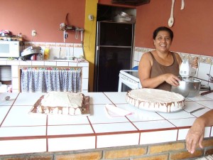 Telma baking cakes for the group
