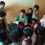 Handing out shirts for the kids in the Hogar